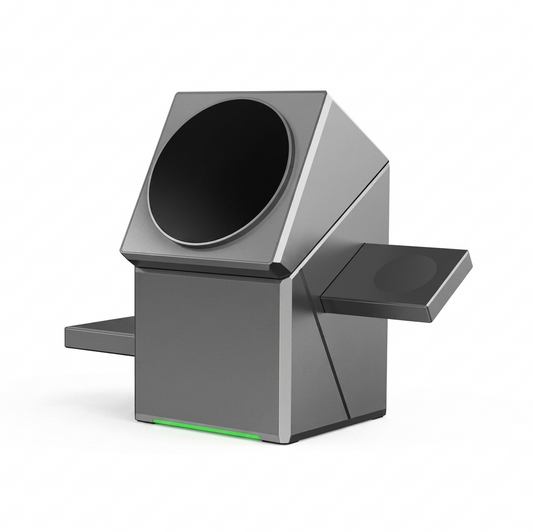 A modern, geometric gray electronic device with a large circular black panel on its upper section, a side-mounted display screen, and a thin green light strip along the base, shown on a solid white background.
